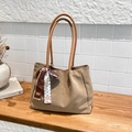Minimalist khaki large capacity tote bag with silk scarf on a stylish wooden shelf - Khaki