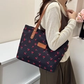 Fashionable black tote bag with red cherry prints and brown leather straps for women - Black