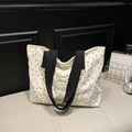 Beige corduroy tote bag with heart and bow patterns and a black wide strap - White