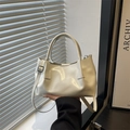 Chic off-white faux leather underarm tote with adjustable strap and pleated finish - White
