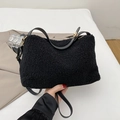 Soft black faux shearling shoulder bag with leather strap and gold hardware accents - Black