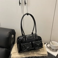 Black glossy shoulder bag with bow details and front pockets for trendy women - Black