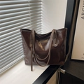 Dark brown high-gloss leather tote bag with thin double straps and minimalist fashion tag - Brown