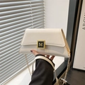 White leather shoulder bag with gold M-buckle and metal chain strap for women - White