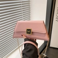 Pink minimalist trapezoid handbag with gold M-letter clasp and chain shoulder strap - Pink