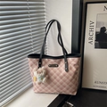 Pink and white checkered tote bag with plush charm and black handles in natural window light - With Pendant / Black