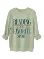 Close-up of reading is my favorite sport text on a light green long sleeve sweatshirt - Olive Green