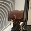 Brown faux leather crossbody bag with gold U-shaped buckle and chain strap - Brown
