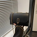 Minimalist black square crossbody bag with gold chain strap and textured matte finish - Black