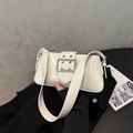 Retro cream underarm bag with decorative silver buckle and glossy leather finish - White
