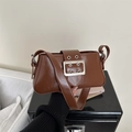 Minimalist brown retro underarm bag in glossy leather with oversized silver buckle - Tan