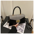 Detail of the chic black leather and grey tweed stitching with golden M buckle - Black