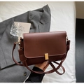 Detailansicht der braunen Vintage-Handtasche mit goldener Schnalle und Riemen - Kaffeebraun