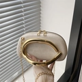 Elegant beige suede circular evening bag with golden horseshoe metal handle and chain - White