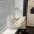 White quilted tote bag with diamond stitching and side pocket for daily styling - White