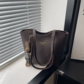 Vintage dark brown tote bag with leather texture and cute rabbit charm on a windowsill - With Pendant / Brown