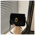 Retro black leather crossbody bag featuring suede flap and gold horseshoe lock - Black