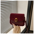 Vintage burgundy saddle bag with suede texture and iconic golden U-shaped hardware - Red