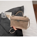 Detail of beige suede box bag featuring a silver metal zipper with double heart sliders - Khaki