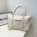 Cream white large capacity travel bag with textured fabric and adjustable strap - White