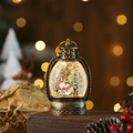 Detail of vintage bronze Christmas lantern featuring snow globe swirling glitter inside - Bronze Snowman
