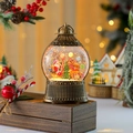 Close-up of vintage bronze Christmas lantern with Santa scene and warm LED glowing glitters - Reindeer Sleigh Style