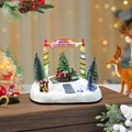 Close-up of lighted Christmas musical box with rotating train and festive snow scene - Rotating Christmas Tree