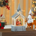 Detalle de una linterna navideña con forma de iglesia con Papá Noel y árbol de Navidad - Papá Noel