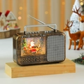 Detalle de lámpara de radio vintage con bola de nieve, Papá Noel y árbol de Navidad - Estilo Papá Noel Bronce
