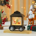 Detailansicht einer Vintage Weihnachts-Schneekugel-Kutsche mit Weihnachtsmann und Licht - Weihnachtsmann