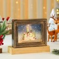 Detalle de marco navideño iluminado con muñeco de nieve, purpurina y borde dorado - Muñeco de Nieve