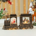 Macro view of vintage Christmas train light with Santa and snowman scene inside - Bronze