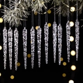 Set of 12 clear acrylic icicle ornaments hanging on green pine branches for Christmas - Clear