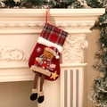Detail of red Christmas stocking with 3D plush bear and long legs hanging on fireplace - Bear Style