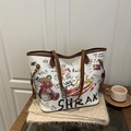 White graffiti printed tote bag with cartoon patches and brown leather handles - White