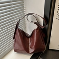 Minimalist large burgundy leather hobo bag with adjustable wide strap and zip closure - Red