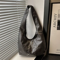 Retro black leather hobo bag with silver star-shaped rivet studs and shoulder strap - Black