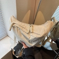 Chic beige nylon crescent crossbody bag with woven zipper pull and adjustable strap - Off-white