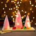 Close-up of pink sisal Christmas trees with warm LED lights and wooden tray set - Pink Set