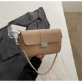 Close-up of beige rectangular leather crossbody bag with metal buckle and chain strap - Khaki
