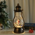 Vintage bronze Christmas lantern with snowman and warm glowing LED light - Rotating Snowman
