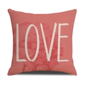 Detail of coral linen pillowcase featuring a pink carnation and white LOVE typography - Pink LOVE Floral Style (YMM4-1)