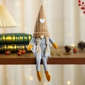 Nordic sitting knitted gnome doll with brown striped hat and long hanging legs - Brown Braids Style