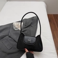 Black crocodile pattern underarm bag with silver metal bow clasp and sleek shoulder strap - Black