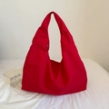 Detail view of the spacious red nylon hobo bag with seamless strap and zipper closure - Red