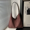 Minimalist deep burgundy suede tote bag with slim shoulder straps in a minimalist setting - Brown