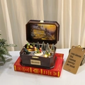 Lighted rotating wooden Christmas music box with snowy miniature tree and warm LED lights - Doll Style