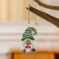 Gnome wood ornament with green striped hat and gift box on a branch for Christmas trees - Green Striped Hat Style