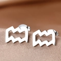 Macro shot of silver wave earrings on champagne silk background with butterfly backs - Silver Aquarius (F1206-Aquarius)