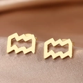 Macro shot of gold Aquarius zodiac stud earrings on champagne silk background - Gold Aquarius (F1205-Aquarius)